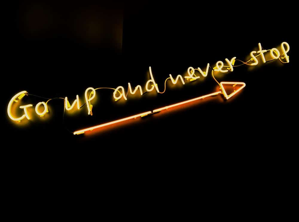 go up and never stop neon sign