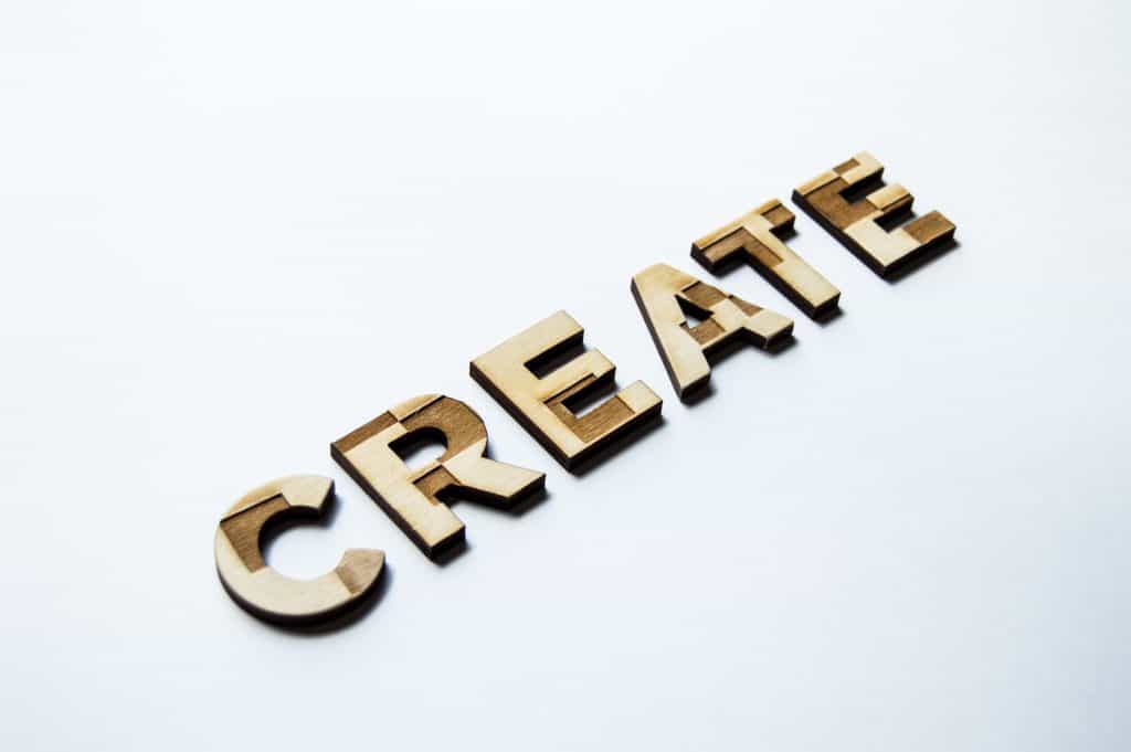 the word create made out of wood