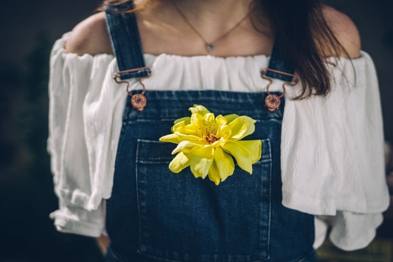 yellow flower woman with yellow flower in pocket