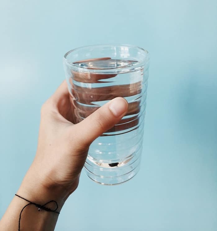 two cup method 3 hand holding glass of water