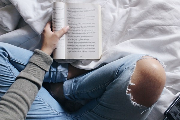 person reading on bed