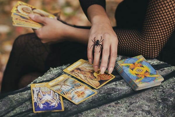 tarot for personal growth person reading tarot in nature