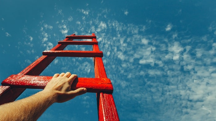 climbing ladder into sky