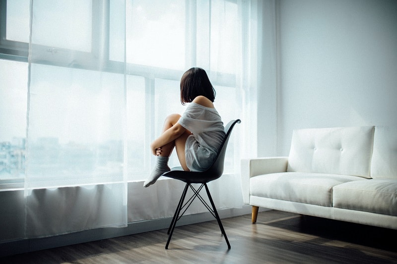 woman waiting by window