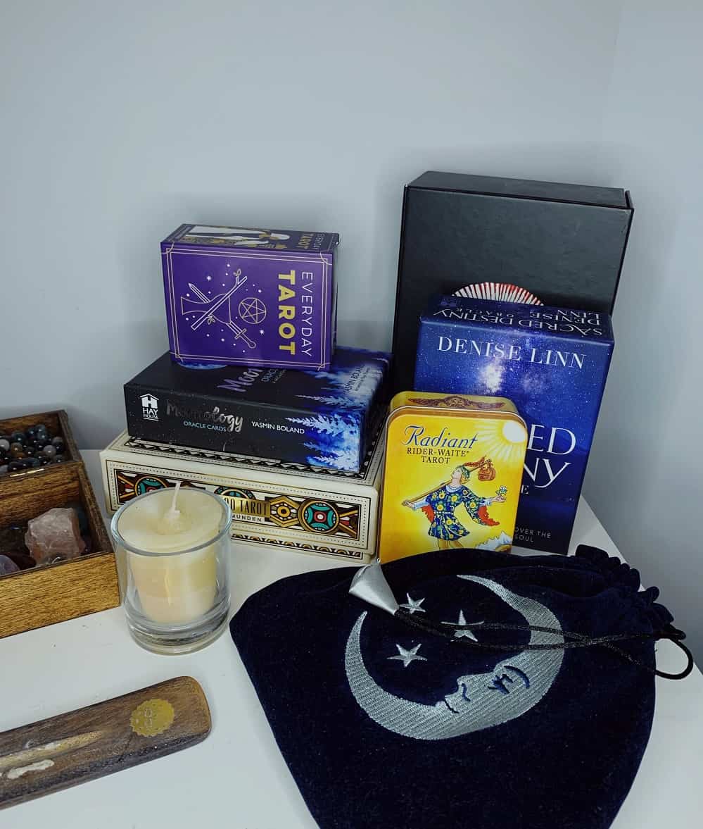 collection of tarot decks on altar