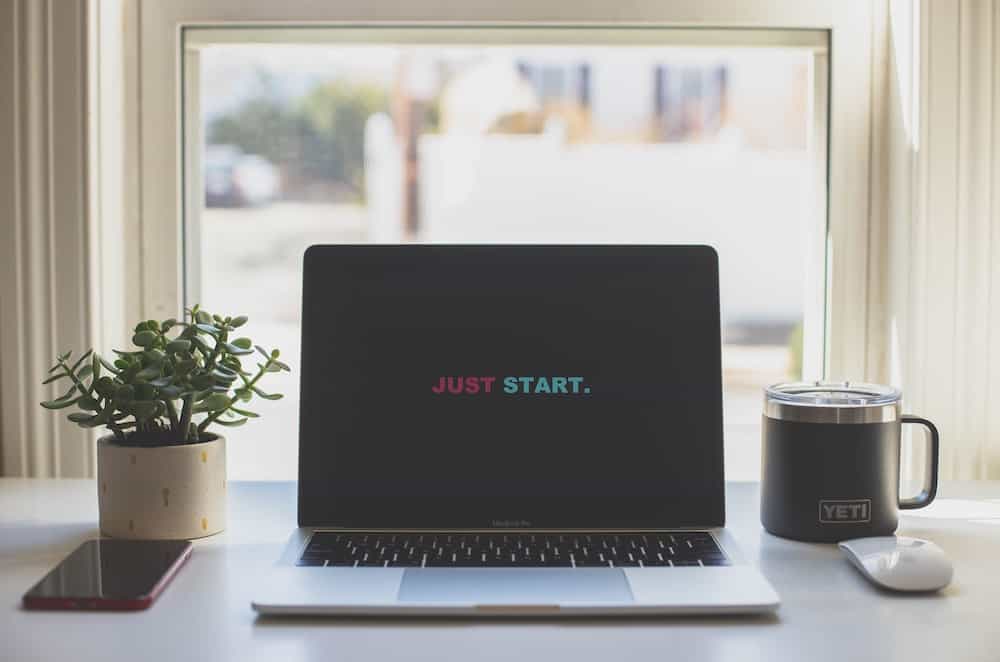 new moon beginnings just start quote on laptop