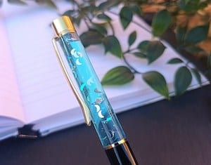 floating crescent moon pen in blue