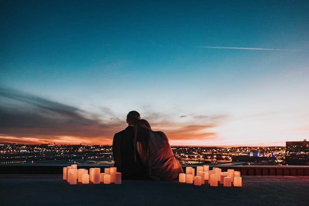 does manifesting a specific person work couple on romantic date with lanterns and sunset