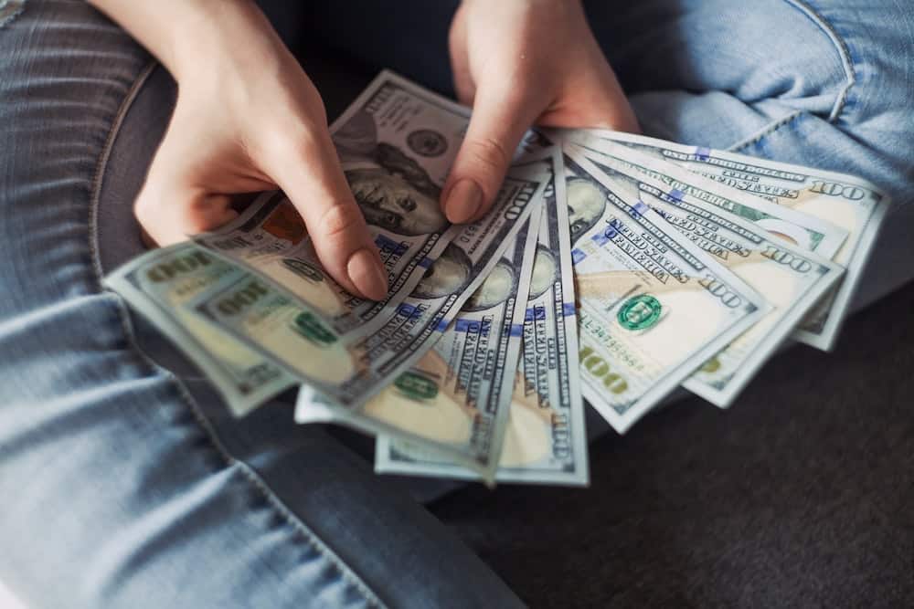person holding money in hands