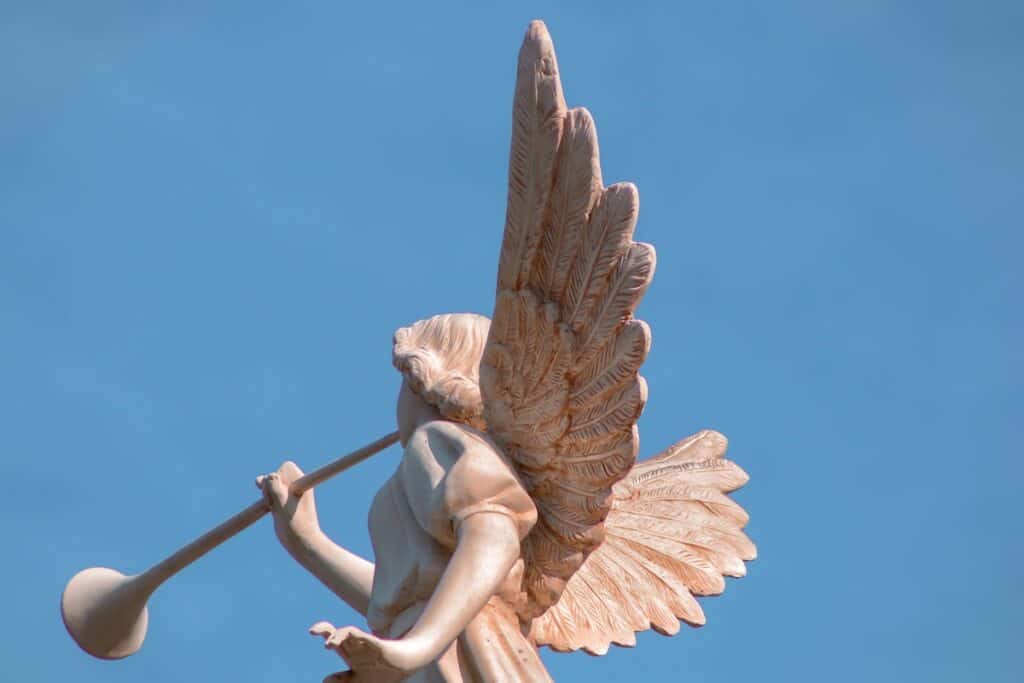 statue of angel playing an instrument