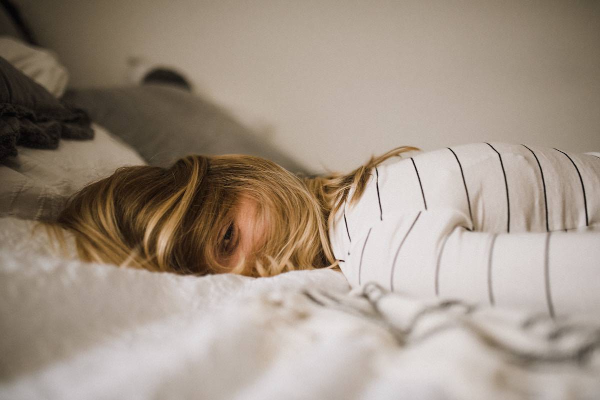 How to JournalSpeak: Journaling for Chronic Symptoms 5 woman lying face down on bed