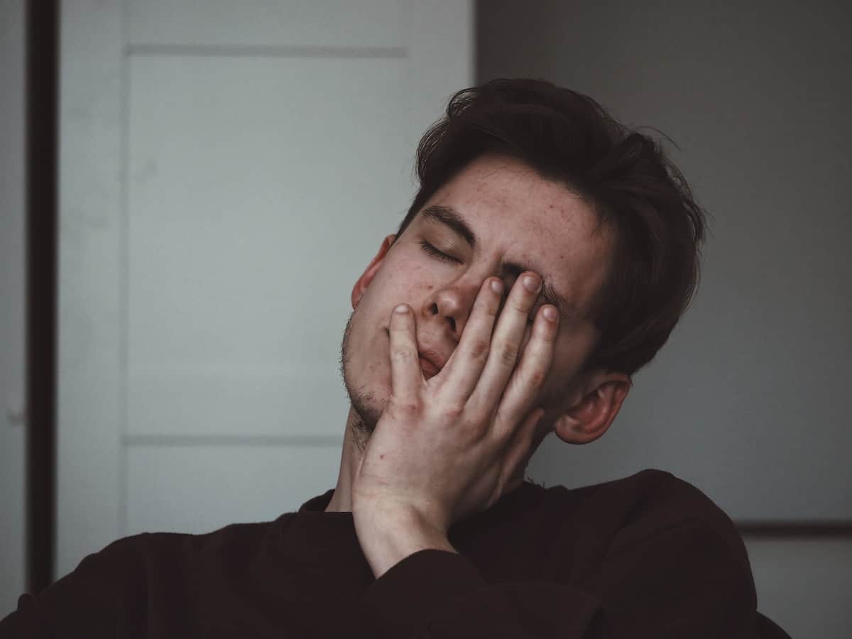 How to JournalSpeak: Journaling for Chronic Symptoms 12 man with head in hands looking in pain