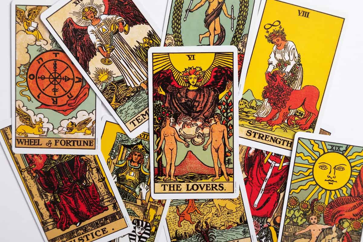 78 Positive Daily Tarot Affirmations for your Deck 7 scattered pile of tarot cards
